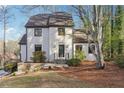 Beautifully landscaped two-story home with classic architectural details and a welcoming front entrance at 3536 Evans Ridge Trl, Atlanta, GA 30340