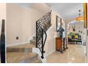 Elegant staircase with ornate railing in a home with tile floors at 1680 Perserverence Hill Nw Cir # 23, Kennesaw, GA 30152