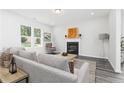 Spacious living room with fireplace and large windows at 317 Lavender Ln, Holly Springs, GA 30115