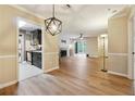 An open-concept layout featuring hardwood floors, a living room, dining area, and modern kitchen at 2824 Vinings Central Se Dr # 146, Atlanta, GA 30339