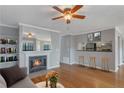 Open living room with kitchen views and hardwood floors at 643 Windchase Ln, Stone Mountain, GA 30083