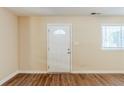 Inviting space with natural light highlighting the newly installed laminate floors at 2720 Santa Barbara Nw Dr, Atlanta, GA 30318