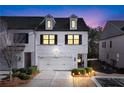 Attractive two-story townhome at dusk, showcasing nighttime curb appeal at 3532 Amarath Ter, Duluth, GA 30096