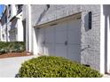 Two-car garage with white doors and black hardware at 3532 Amarath Ter, Duluth, GA 30096