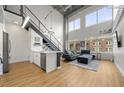 Open living area with high ceilings, modern furniture, and kitchen at 260 18Th St # 10320, Atlanta, GA 30363