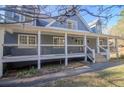 Gray house with wraparound porch and white railings at 1620 Palm St, Canton, GA 30115