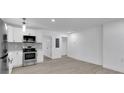 Bright and spacious living room with gray flooring and neutral walls at 1318 Graymont Sw Dr, Atlanta, GA 30310