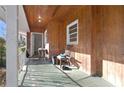 View of a long, covered front porch, with a sitting area at 1405 Pinehurst Sw Dr, Atlanta, GA 30311