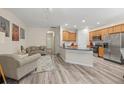 Bright kitchen with stainless steel appliances, light wood cabinets, and open to the living room at 2637 Cedar Dr, Lawrenceville, GA 30043