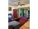 Living room with sectional sofa, coffee table, and red rug at 3825 Lavista Rd # O3, Tucker, GA 30084