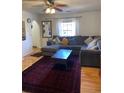 Spacious living room with L-shaped sofa and coffee table at 3825 Lavista Rd # O3, Tucker, GA 30084