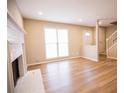 Inviting living room with a traditional fireplace and gleaming hardwood floors at 724 Redland Dr, Jonesboro, GA 30238
