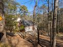 Brick house with a three-car garage and wooded lot at 1480 Niskey Lake Sw Rd, Atlanta, GA 30331