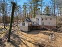 Two-story home with a deck and wooded backyard at 1480 Niskey Lake Sw Rd, Atlanta, GA 30331