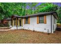 White brick ranch home with a wood accent and updated landscaping at 1934 Pinedale Pl, Decatur, GA 30032