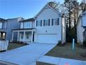 Two-story house with white siding, gray shutters, and a two-car garage at 799 River Gardens Se Dr, Atlanta, GA 30354