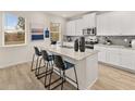 Modern kitchen with white cabinets, granite countertops, and stainless steel appliances at 799 River Gardens Se Dr, Atlanta, GA 30354