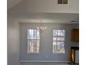 Bright dining room with chandelier and large windows at 2331 Rambling Way, Lithonia, GA 30058