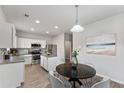 Eat-in kitchen with island and stylish light fixture at 3178 Cedar Crest Way, Decatur, GA 30034