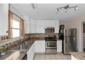 Kitchen with stainless steel appliances and granite countertops at 5514 Park S Pl, Atlanta, GA 30349