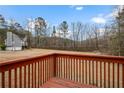 Deck overlooks a large backyard and wooded area at 23 Faith Ct, Douglasville, GA 30134