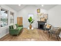 Bright living room with hardwood floors and a cozy fireplace at 2049 Meador Se Ave, Atlanta, GA 30315