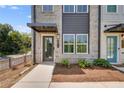 Townhome's front entrance with walkway and landscaping at 2651 Stream Nw Ter, Atlanta, GA 30318