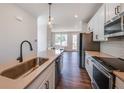 Stainless steel appliances and an island with a quartz countertop at 2651 Stream Nw Ter, Atlanta, GA 30318