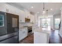 Modern kitchen featuring white cabinets, stainless steel appliances, and a large island at 2651 Stream Nw Ter, Atlanta, GA 30318