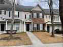 Three-unit townhouse building with sidewalk and lawn at 20 Pine Canyon Sw Dr # 41, Atlanta, GA 30331