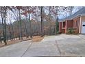 Long driveway leading to home with wooded views at 1050 Wiley Bridge Rd, Woodstock, GA 30188