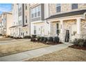 Row of townhomes showcasing inviting front porches and landscaping at 110 Cobalt Dr, Fayetteville, GA 30214