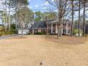 Beautiful two-story home with large yard and classic brick exterior and white columns at 1579 Howell Highlands Dr, Stone Mountain, GA 30087