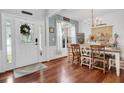 Farmhouse style dining room featuring a wooden table and hardwood floors at 615 Keeneland Ter, Woodstock, GA 30189