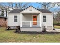 Beautiful single-story home with a cozy front porch and manicured front yard at 2729 Joyce Ave, Decatur, GA 30032