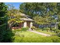 Charming brick home with stone pillars and manicured landscaping at 2220 Edison Ave, Atlanta, GA 30305