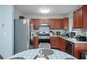 Kitchen with stainless steel appliances and wood cabinets at 30 Springbottom Dr, Lawrenceville, GA 30046