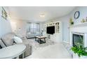 Living room with fireplace and built-in shelving at 30 Springbottom Dr, Lawrenceville, GA 30046