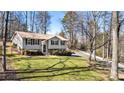 Ranch-style home with a large yard and mature trees at 3001 Scott Rd, Marietta, GA 30066