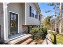 Dark gray front door, brick steps and walkway at 3001 Scott Rd, Marietta, GA 30066