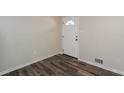 Bright entryway showcasing new floors and a freshly painted front door at 3667 Humphries Hill Rd, Austell, GA 30106
