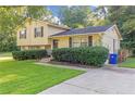 Two-story house with a spacious driveway and lush lawn at 3589 Satellite Blvd, Ellenwood, GA 30294