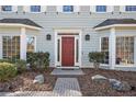 Close-up of the house's front door with brick pathway and lovely landscaping at 450 Surveyors Pt, Suwanee, GA 30024