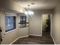 Simple dining room with laminate flooring and neutral walls at 1079 Salisbury Trl, Riverdale, GA 30296