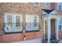 Townhome exterior detail; balcony with iron railings and double doors at 4694 Wehunt Commons Se Dr # 25, Smyrna, GA 30082