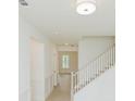 Light and airy foyer featuring a staircase at 6585 Rhett Run, Cumming, GA 30028