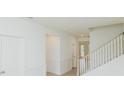 Bright entryway with staircase and neutral colors at 6585 Rhett Run, Cumming, GA 30028