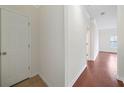 Clean hallway with hardwood floors and neutral walls at 2211 Westchester Rdg, Atlanta, GA 30329