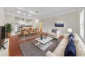 Living room with hardwood floors and open concept kitchen at 2211 Westchester Rdg, Atlanta, GA 30329