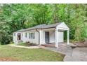 Recently renovated white ranch home with carport at 2705 Baker Ridge Nw Dr, Atlanta, GA 30318